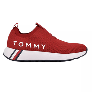 A red slip-on sneaker with \“TOMMY\“ on the side, featuring a breathable mesh upper and a white sole with navy and red stripes.