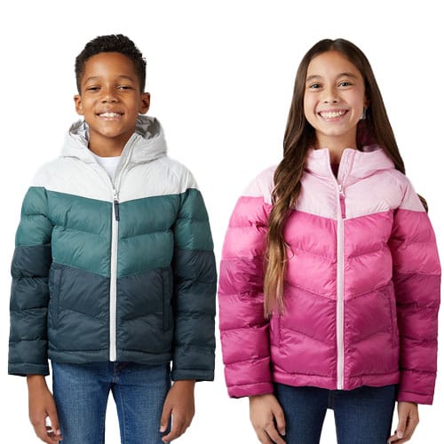 Two children are wearing colorful puffer jackets; one in green tones and the other in pink tones, both with hooded designs.
