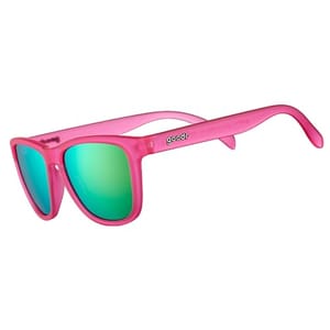 Pink sunglasses with green reflective lenses and the brand name \“goodr\“ on the arm.