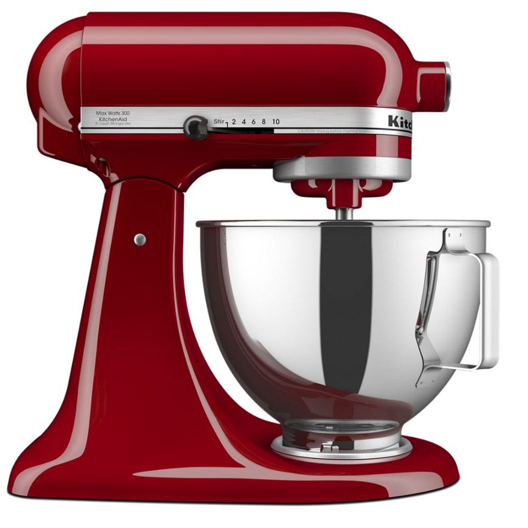A red KitchenAid stand mixer with a stainless steel bowl, featuring multiple speed settings.