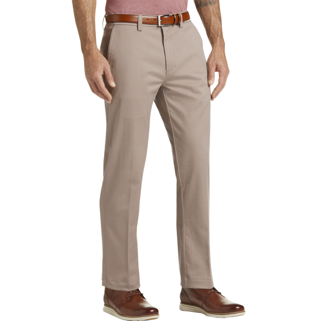 A pair of beige chinos with a brown leather belt and brown leather shoes, worn by a person. The person is also wearing a red shirt.