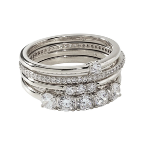 A set of stacked platinum rings featuring multiple rows of diamonds in various settings, offering a luxurious and sparkling design.