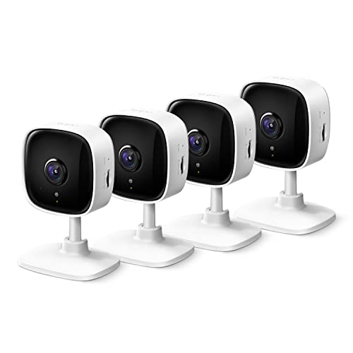 Four white TP-Link 2K security cameras with black camera lenses, mounted on matching white stands with a compact, rectangular design.