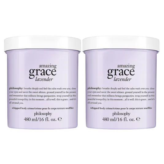 Two containers of Philosophy's \“Amazing Grace Lavender\“ whipped body crème, each 480 ml/16 fl. oz., featuring a calming lavender formula with soothing text on the packaging.