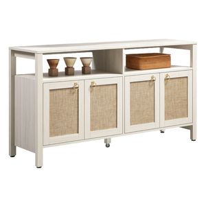 The 65\“ Sicotas TV Stand features a light wooden finish with woven rattan-style cabinet doors, gold ring handles, and an upper shelf space displaying a few small decorative items.