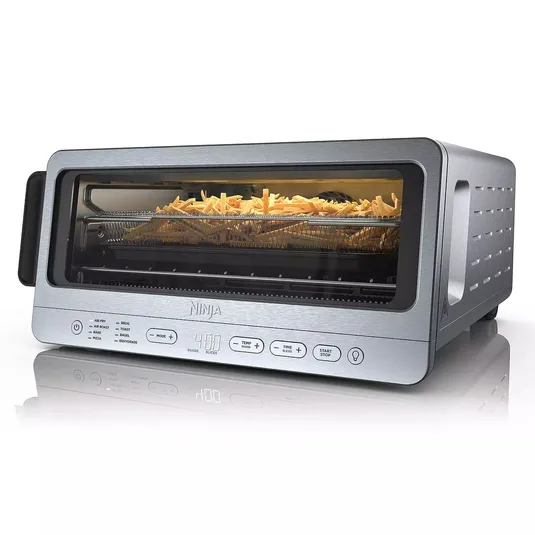 Ninja Flip Oven is a compact countertop appliance featuring a sleek stainless steel design with a glass front, showcasing fries inside. It offers multiple cooking functions like air fry, roast, toast, and bake, with controls for temperature and time.