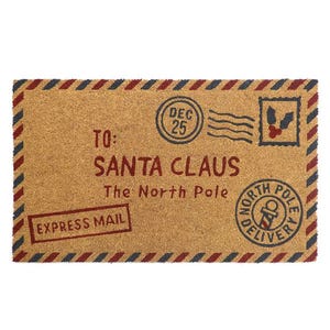 A doormat designed to resemble a mail package addressed to Santa Claus at the North Pole, featuring postal-themed graphics such as a stamp and express mail marking.