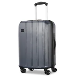 A gray hard-shell suitcase with a retractable handle and four double spinner wheels, featuring a textured surface and a side handle.