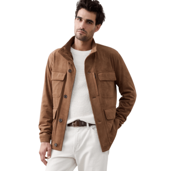 A man wears a brown suede jacket, white sweater, cream-colored pants, and brown lace-up boots, accessorized with a brown belt.