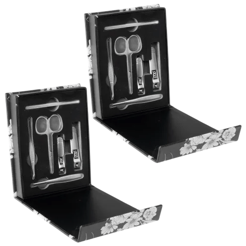 Two manicure sets in floral black boxes, each containing scissors, nail clippers, a nail file, tweezers, a cuticle pusher, and an ear pick.