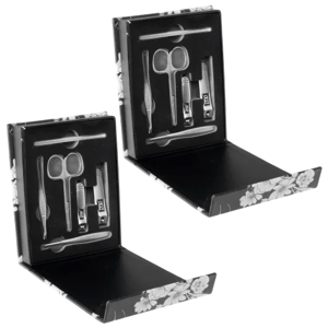 Two manicure sets in floral black boxes, each containing scissors, nail clippers, a nail file, tweezers, a cuticle pusher, and an ear pick.