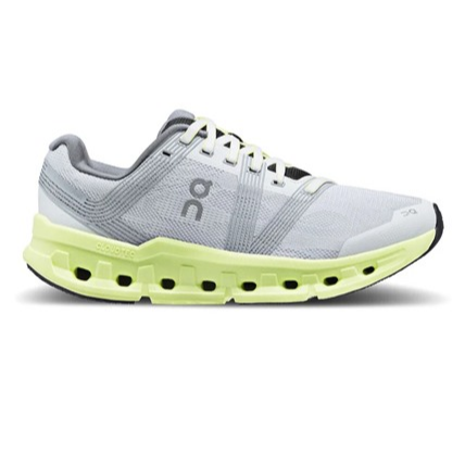 Athletic shoe with a gray and white mesh upper, featuring a distinctive lime green sole with visible air cushioning elements.