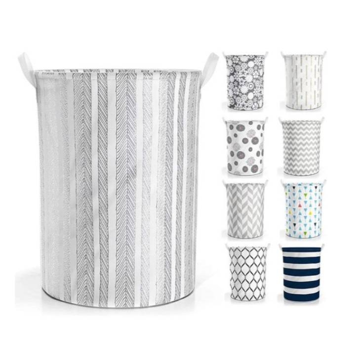 A laundry hamper with a chevron pattern and a set of decorative waste paper baskets in various designs.