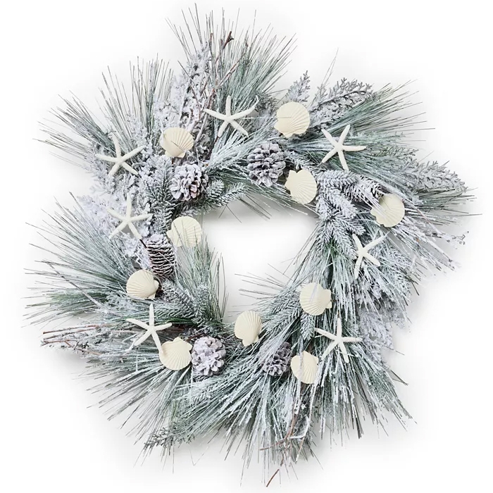 A frosted wreath decorated with seashells, starfish, and pinecones, combining coastal and wintry elements for a festive touch.