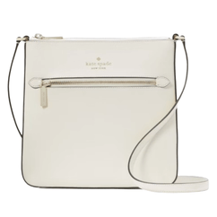 A white Kate Spade New York crossbody bag featuring a slim design, front zipper pocket, and adjustable strap.