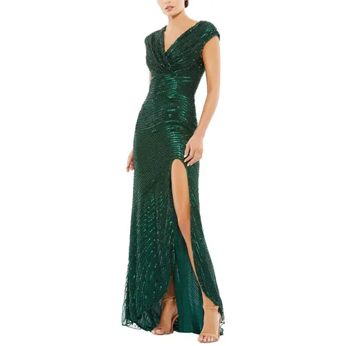 An elegant green sequin evening gown featuring a V-neckline, cap sleeves, and a thigh-high slit, paired with strappy heels.