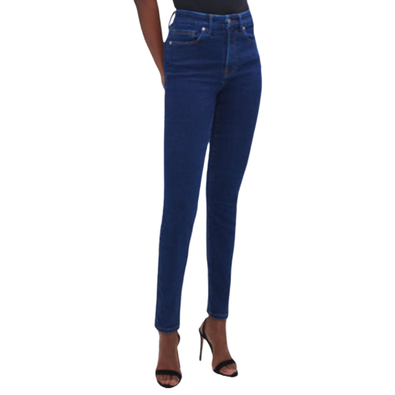 Dark blue skinny jeans with a high waist design, featuring classic pocket details and paired with black strappy heels.