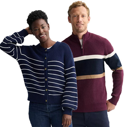 Two people are wearing sweaters: the woman in a navy blue cardigan with white stripes and the man in a burgundy quarter-zip sweater with navy, white, and tan stripes.