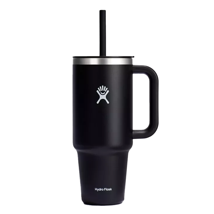 Black Hydro Flask travel mug with a handle and straw, featuring the brand's logo.