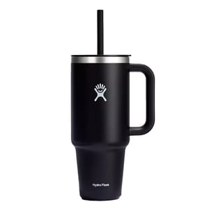 Black Hydro Flask travel mug with a handle and straw, featuring the brand's logo.