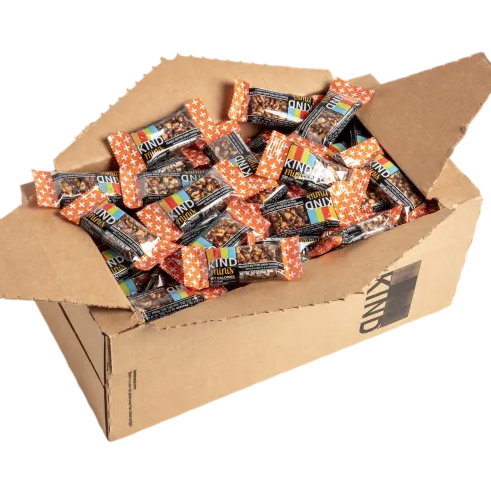 A cardboard box is filled with KIND bars wrapped in orange and black packaging.