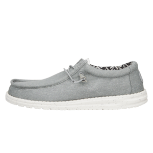 Gray slip-on shoes featuring a soft canvas upper, elastic laces, and a cushioned white sole with speckles. The interior has a patterned lining providing a casual and comfortable look.