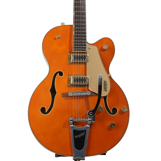 An orange Gretsch hollow-body electric guitar with f-holes, gold pickguard, dual humbucker pickups, and a Bigsby tremolo system.