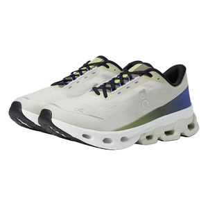 White and light green running shoes with a unique sole design featuring large hollowed-out circles and a blue heel accent, equipped with blue laces.