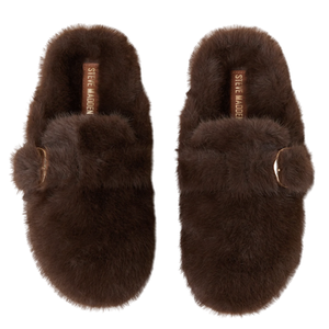 Brown fuzzy slippers with a strap and buckle detail, labeled \“Steve Madden\“.