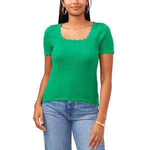 A green short-sleeve, scalloped neckline knit top paired with light blue denim jeans.