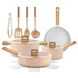 A cookware set includes pots, pans, and lids with wood-like handles, alongside kitchen utensils such as tongs, a spatula, and ladles, all in a peach color with non-stick surfaces.