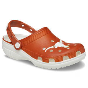 Orange Crocs clog with a white longhorn logo, featuring ventilation holes, a heel strap, and a white sole.