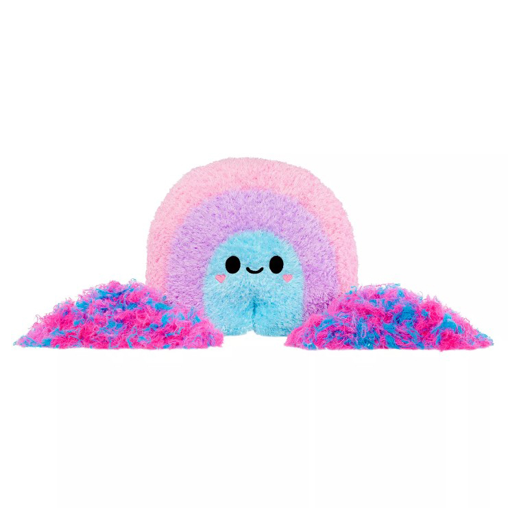 A colorful plush toy shaped like a smiling rainbow with pink, purple, and blue hues, accompanied by two piles of matching fluffy material.
