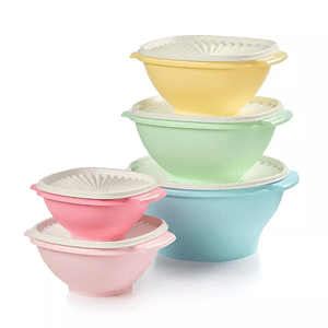 A set of five nesting mixing bowls in pastel colors, each with a matching lid. The bowls are pink, blue, green, yellow, and light pink, designed for space-efficient storage.