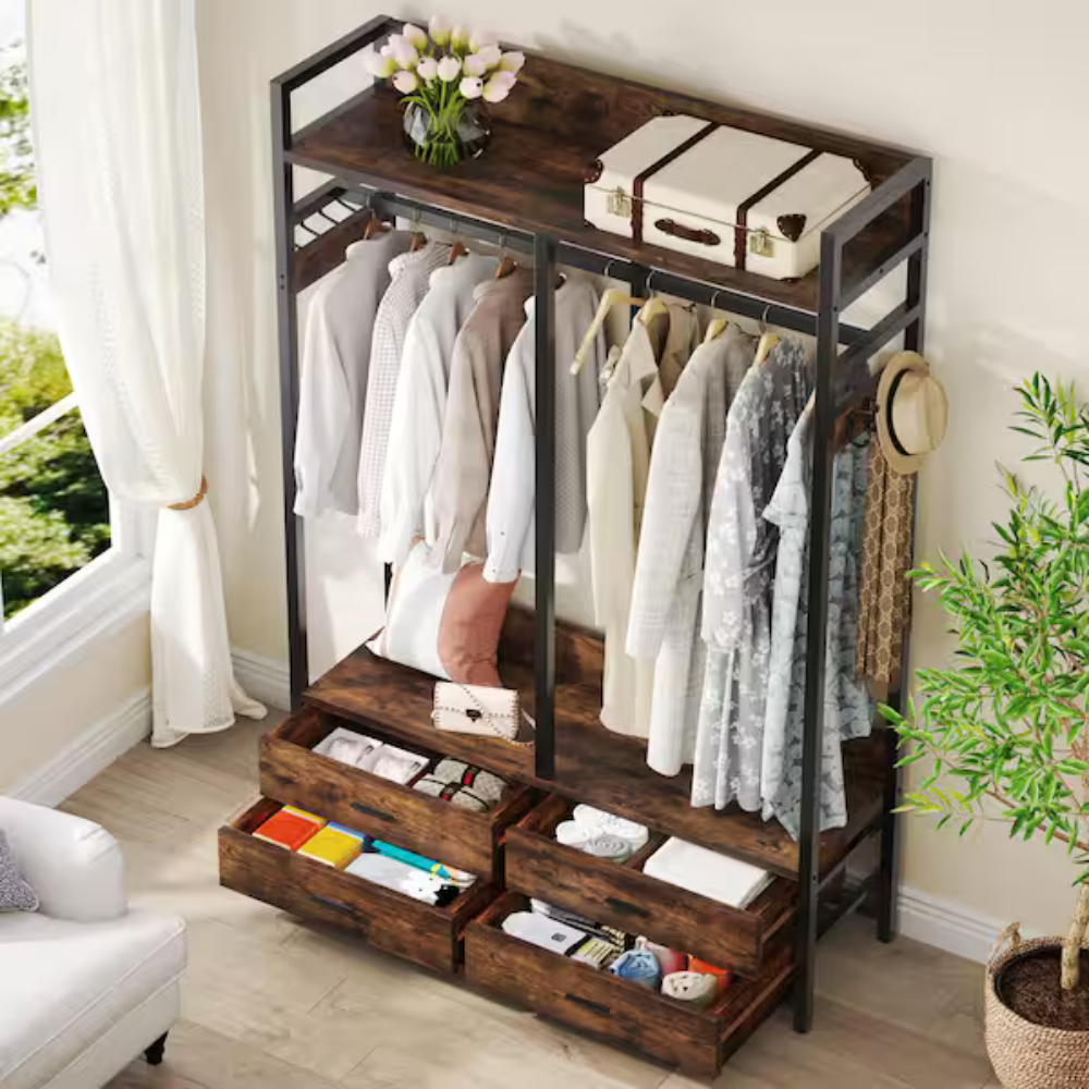 A rustic open wardrobe features a metal frame with wooden shelves, hanging space for clothes, and several drawers. The top shelf holds a suitcase and a vase of flowers.