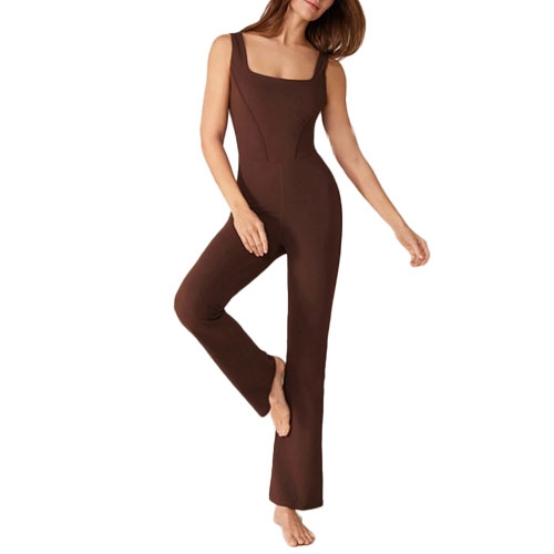 A brown, sleeveless, form-fitting jumpsuit with a square neckline, extending to the ankles, shown on a person standing with one leg slightly raised.