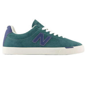 New Balance Numeric 22 Shoes feature a teal suede upper with a white rubber sole, blue lettering, and white laces, designed for a sleek and casual look.