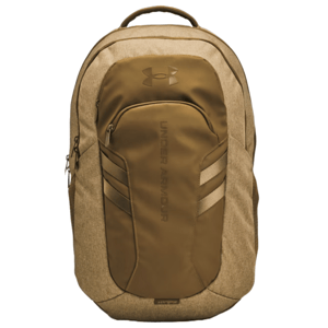 UA Hustle 6.0 Pro Backpack is a tan-colored Under Armour backpack with a sleek design, featuring a large main compartment, a front pocket with the Under Armour logo, and adjustable side pockets.