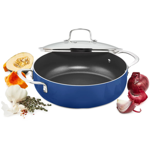 A blue 5-quart nonstick everyday pan with a glass lid and stainless steel handles is shown surrounded by garlic, thyme, pumpkin, and red onions.
