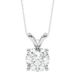 A silver necklace featuring a round-cut diamond pendant in a four-prong setting.