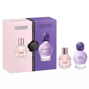 Viktor & Rolf Flowerbomb Perfume Set includes two fragrances: Flowerbomb (pink bottle) and Good Fortune (purple bottle), presented in a dual-colored box with pink and purple hues.