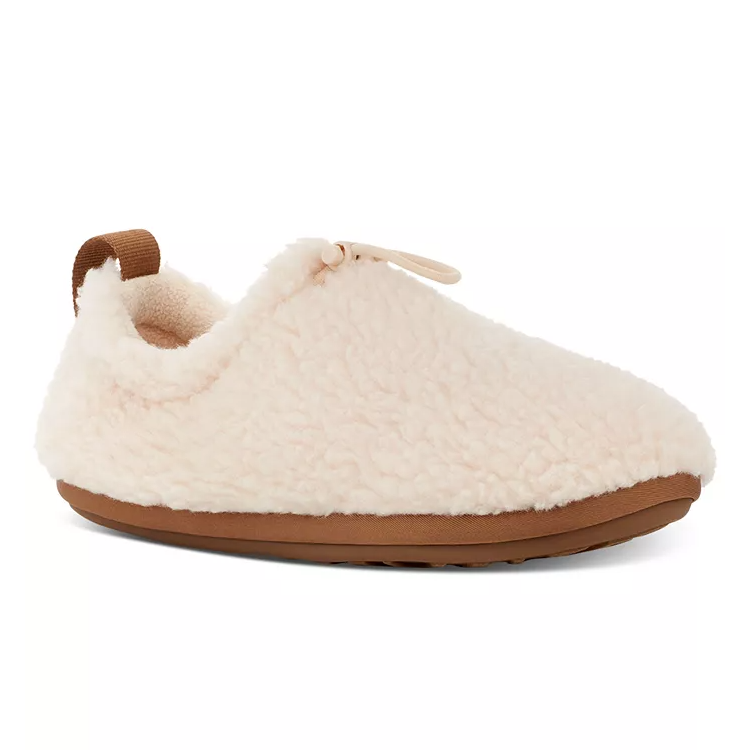 UGG Plushy Slippers are light-colored, fluffy slip-ons with a soft, textured upper and a contrasting brown rubber sole for grip.