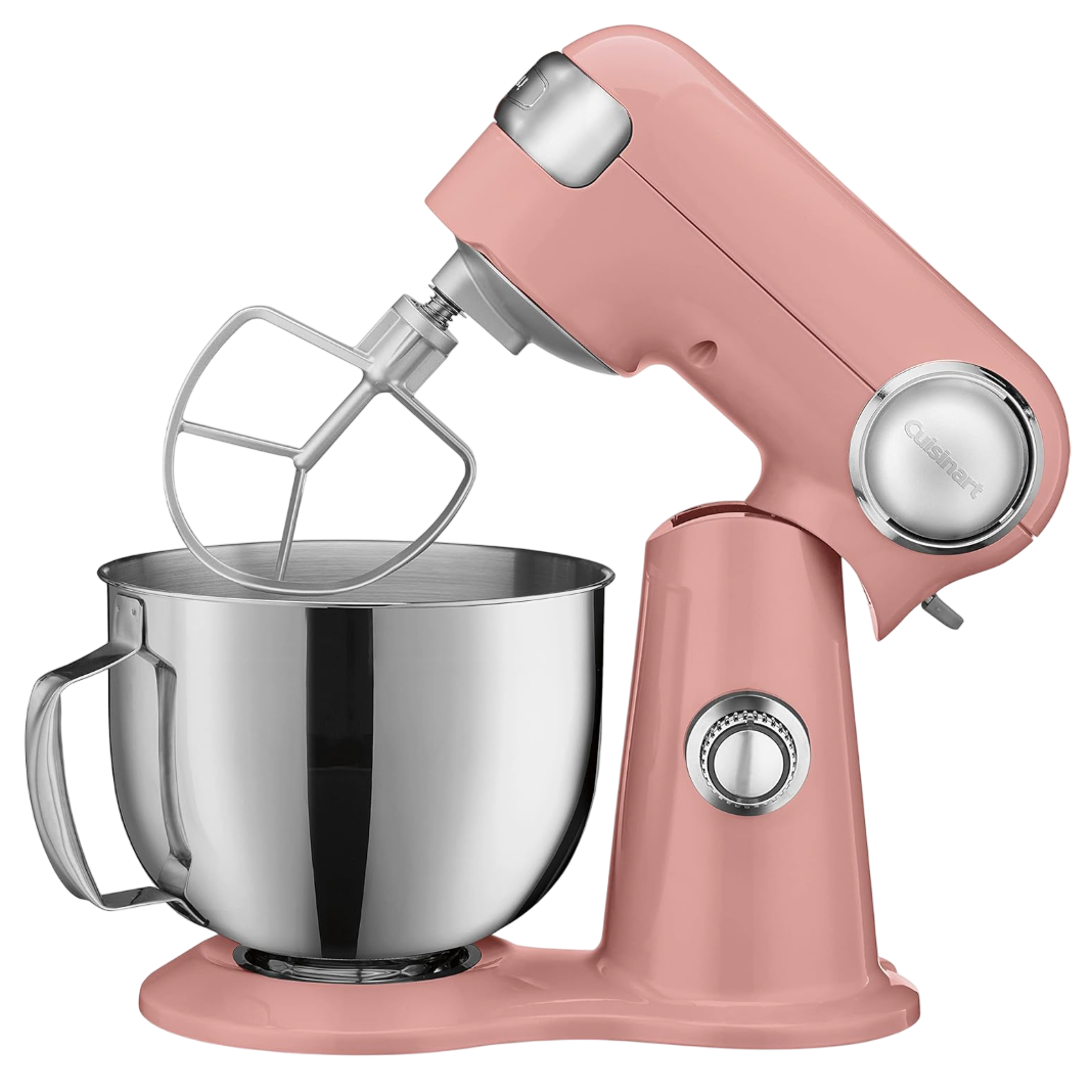 A pink stand mixer with a metal mixing bowl and a flat beater attachment, featuring a dial control on the side.