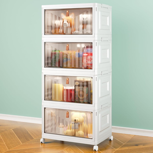 A four-tiered rolling storage unit with transparent front panels displays various items, including drinks and stuffed toys, on a wooden floor against a mint-green wall.