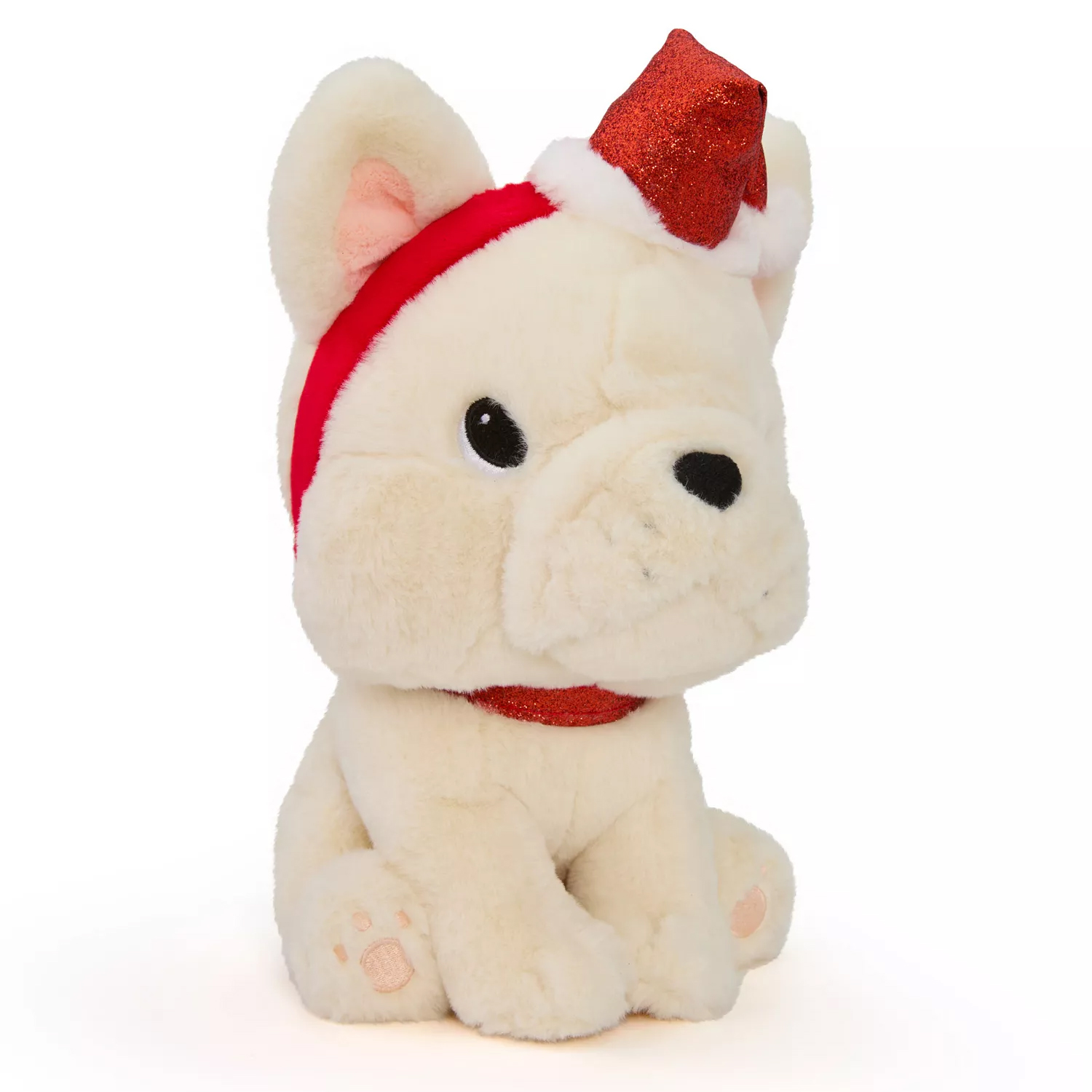 A plush toy resembling a white bulldog wearing a red and white Santa hat and a red glittery collar.