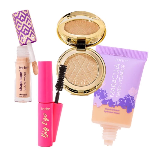 Tarte cosmetics collection featuring Shape Tape Glow Wand, Big Ego mascara, Maracuja Tinted Hydrator, and a compact highlighter.