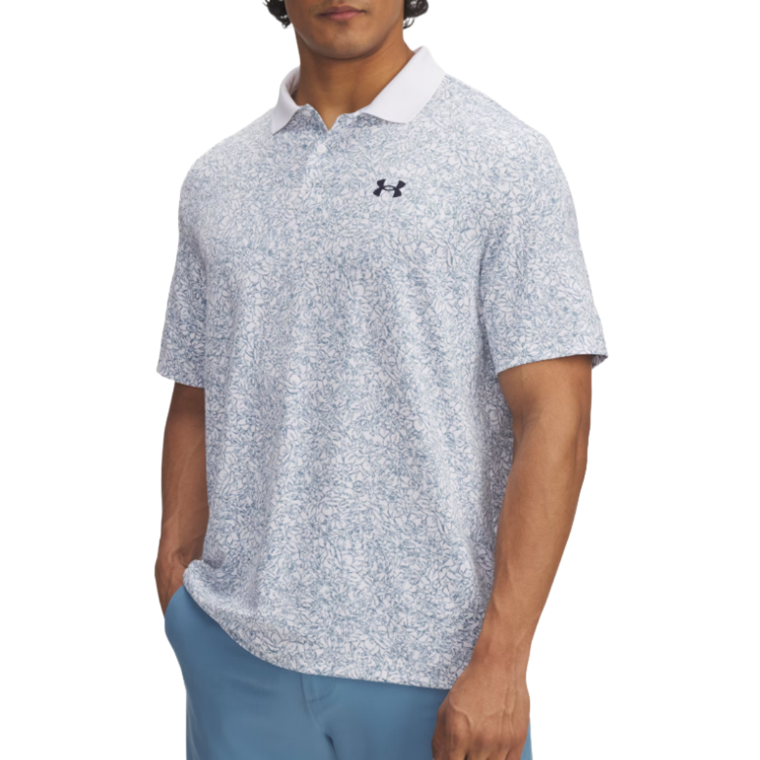 A man wearing a light blue and white patterned Under Armour polo shirt with a white collar and matching blue pants.