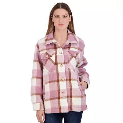 A woman models a juniors' cozy shacket featuring large pink and white horizontal stripes, button closures, and two chest pockets.
