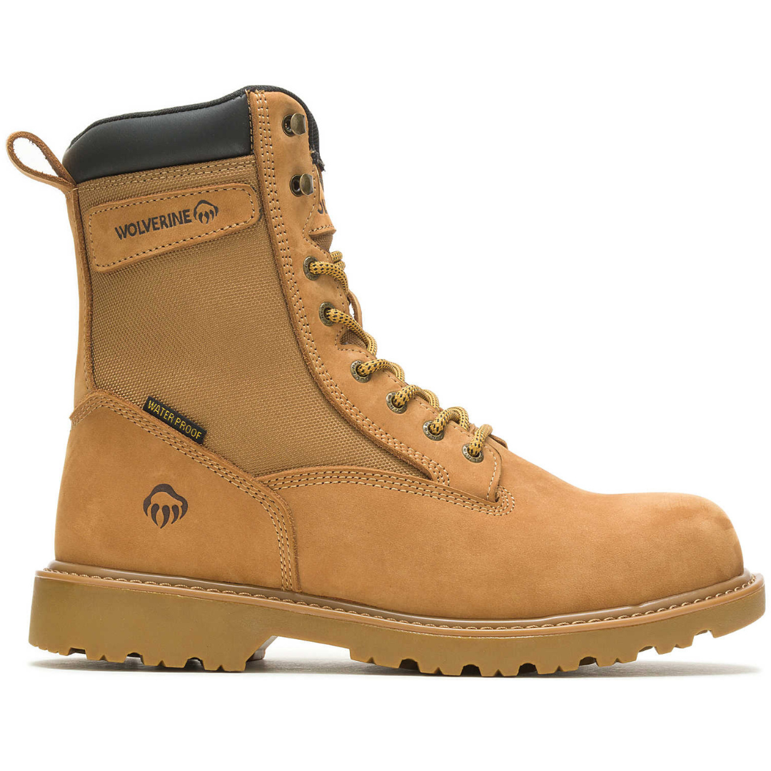 Wolverine waterproof work boot in tan with black padded collar, lace-up eyelets, and a textured rubber sole for traction.