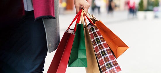 A shopper celebrates the new Black Friday. . . shopping season!